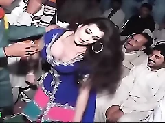 Sexy Pakistani dancer performs sensual moves, revealing curves and arousing desire.
