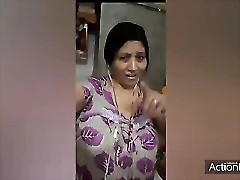 A mature Desi aunt indulges in a sensual massage and oral sex with a younger man.